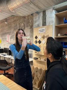 Lucy shows the students laser cut artifact1